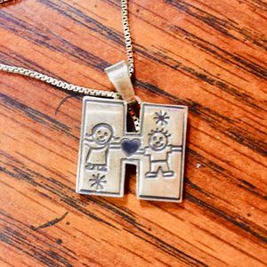 Vintage sterling silver pendant with H charm